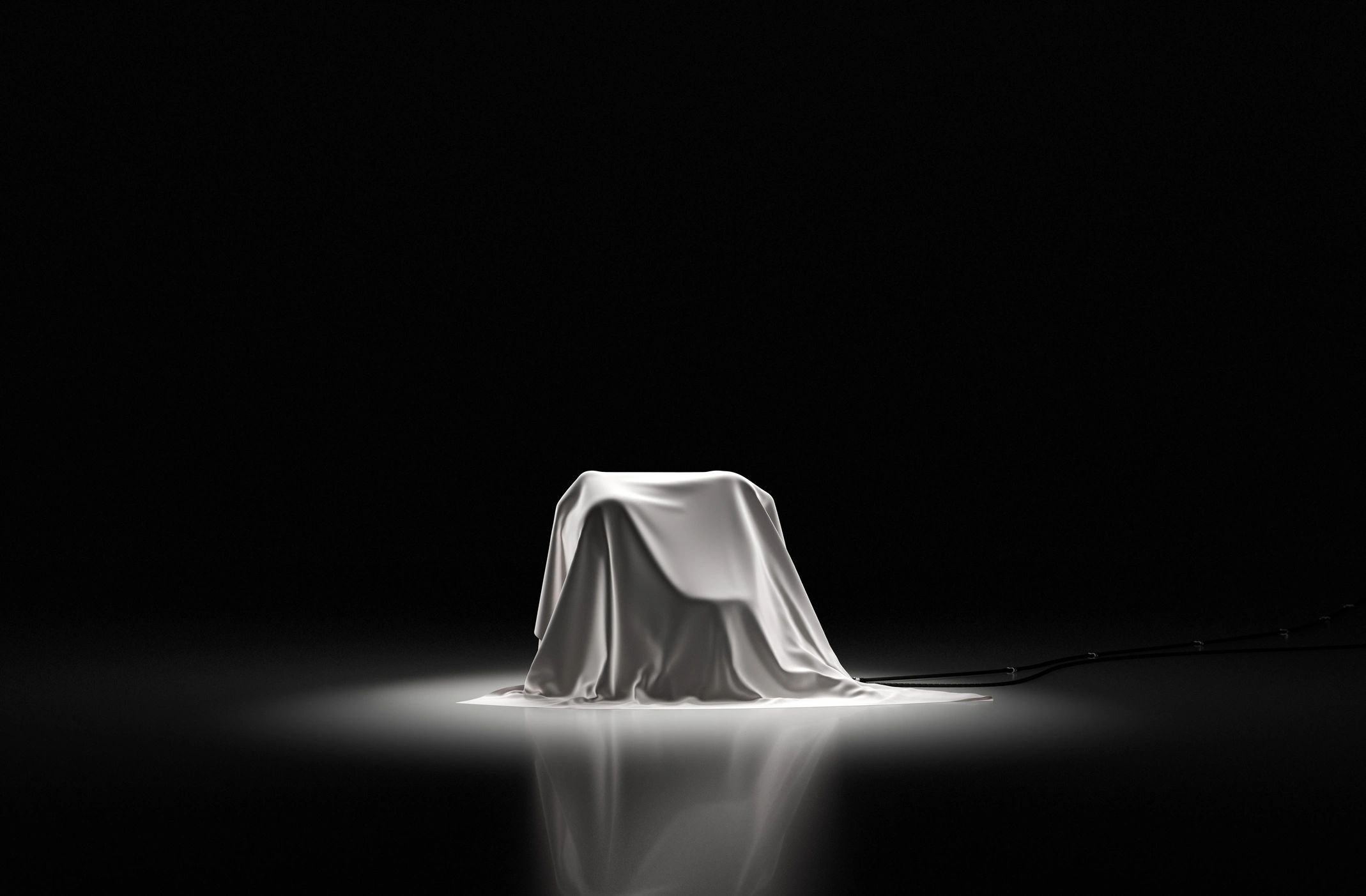 Premium showroom reveal scene with dramatic presentation